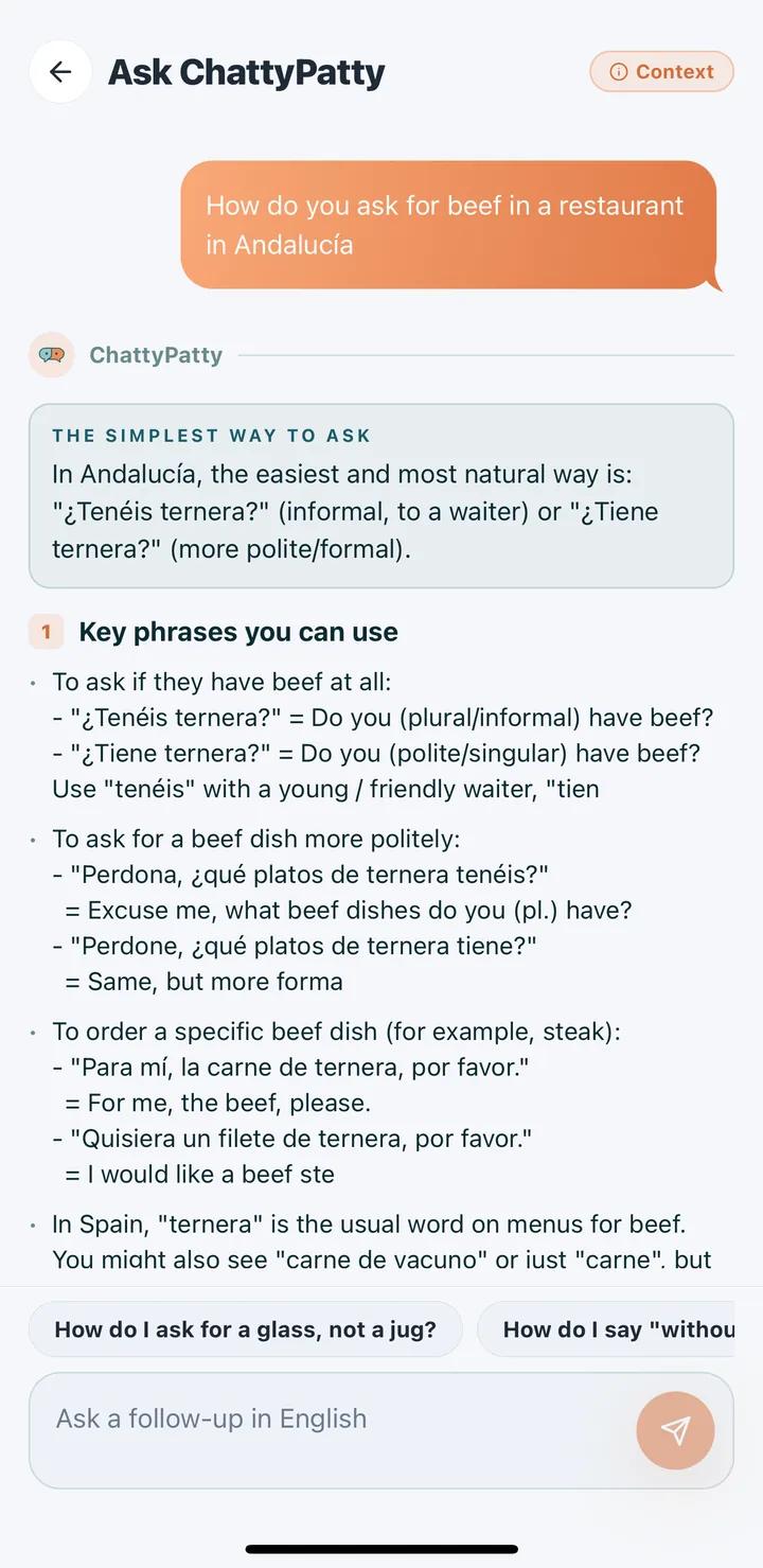 Ask ChattyPatty answering a learner's question about ordering food in Spanish, with example phrases and translations